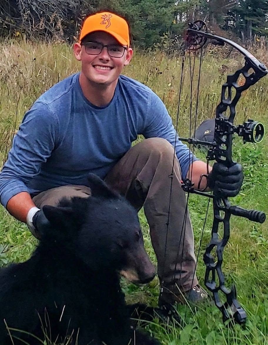 Alec with his black bear harvest